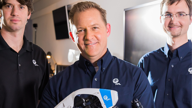 Three employees smiling