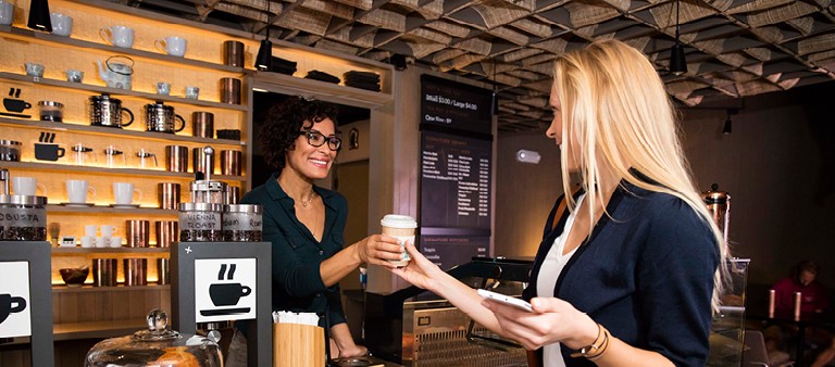 woman ordering coffee at a small business